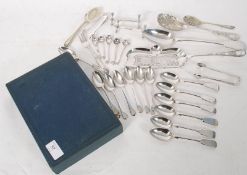 A quantity of Silver plated cutlery to include tea spoons, knife rests etc please see images