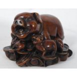 An Asian / Oriental resin pig and piglets