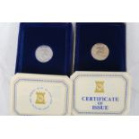 2x Silver Proof Coins; Pobjoy Mint Isle Of Man pound coins x 2, both boxed with certificates.