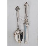 A good  Edwardian Art Nouveau silver plated large letter knife together with a similar spoon, the
