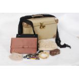 A 1950's vanity case containing evening bags, hats etc