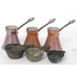 A set of 3 copper measures together with a copper taste de vin