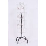 A mid 20th century plastic coated tubular metal rotating Industrial shop card display unit on