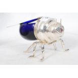 A 20th century glass silver plated honey pot in the shape of a bee.  Weight 415 grams