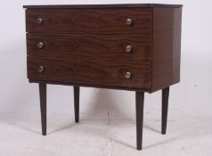 A retro 1970's Schreiber 3 drawers chest of drawers raised on tapered supports with laquered finish.