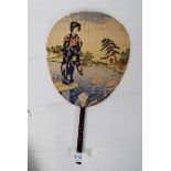 A good 1930's Japanese fan with decorative scenes of geisha on paper with wooden inlaid handle