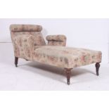 A Victorian chaise longue in the manner of Howard & Son, London. Raised on mahogany turned legs with