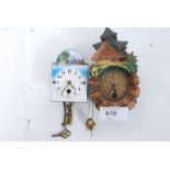 2 miniature Black Forest wall clocks one with porcelain face.