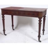 A 19th century Regency mahogany writing table desk. Raised on turned tapered legs with castors