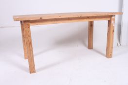 A good 20th century Shabby Chic oval country pine dining  table raised on turned legs with fitted