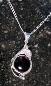 A silver and amethyst pendant necklace i