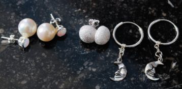 Three pairs of silver and gem set earing