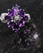 A silver CZ and amethyst ring