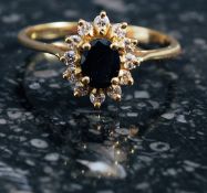 Yellow gold sapphire and diamond cluster