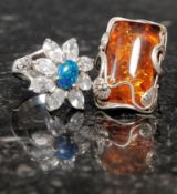A silver and amber style ring together w