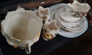 A large selection of china trays with floral patterns