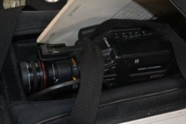 A Cannon camcorder with accessories