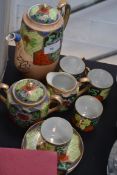 An oriental tea set with a mother of pearl style inlay