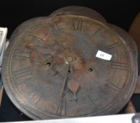 An antique wall clock with Roman numerals