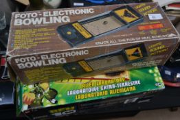 A Foto Electronic bowling game and a Ben 10 alien laboratory