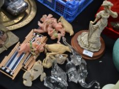 A collection of china miniatures with a figure of a maiden