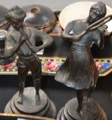 2 brass statues of musicians