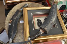 An African drum along with a pair of ceremonial knives in sheaths and a framed carving
