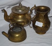 A brass kettle , teapot and vase