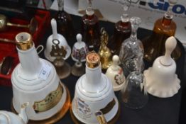 A collection of glass , china and metal bells