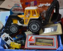 An assortment of diecast cars and toys