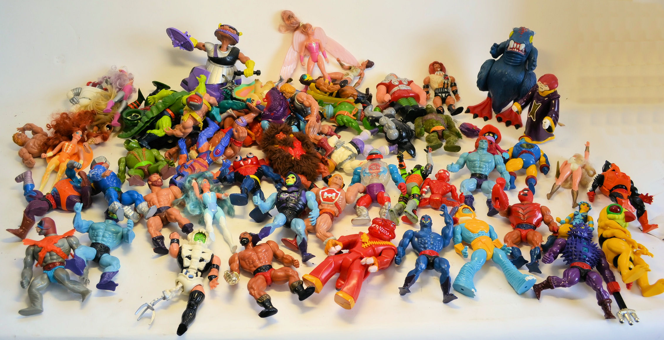 A HUGE collection of original 1980's He-Man action figures (likely 60+), some with accessories