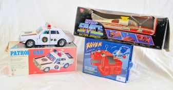 A vintage 1970's tinplate boxed Ship Space spaceship in original box, along with a tin plate Rover