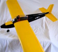 A good model radio controlled aeroplane in black and yellow, with some original radio gear