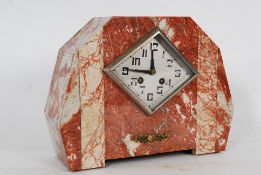 A 1930`s Art Deco French rouge marble mantel clock having 8 day movement striking on a bell. The