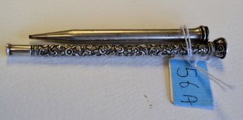A silver rococo decorated in relief propelling pencil  holder with finial top 12cms long. Together