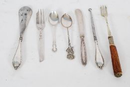 A collection of hallmarked silver handled knives, forks and spoons etc. Along with some white