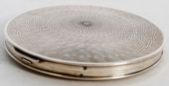 A hallmarked sterling silver ladies makeup compact with chased decoration to case, in original