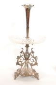A 19th century silver plate and glass epergne in the rococo style having raised terraced base with