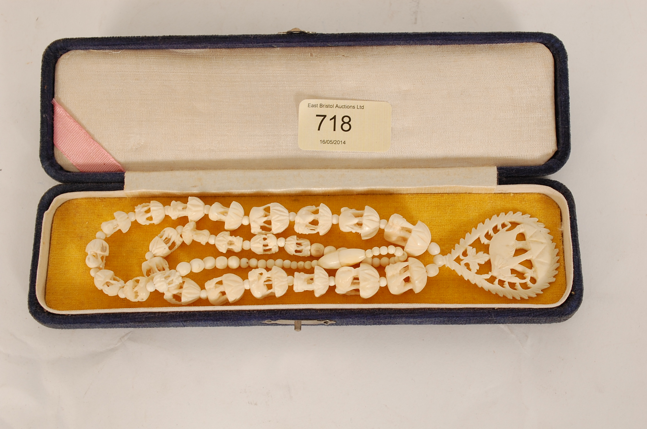 A late 19th / early 20th century graduating ivory carved necklace with elephant detail and carved