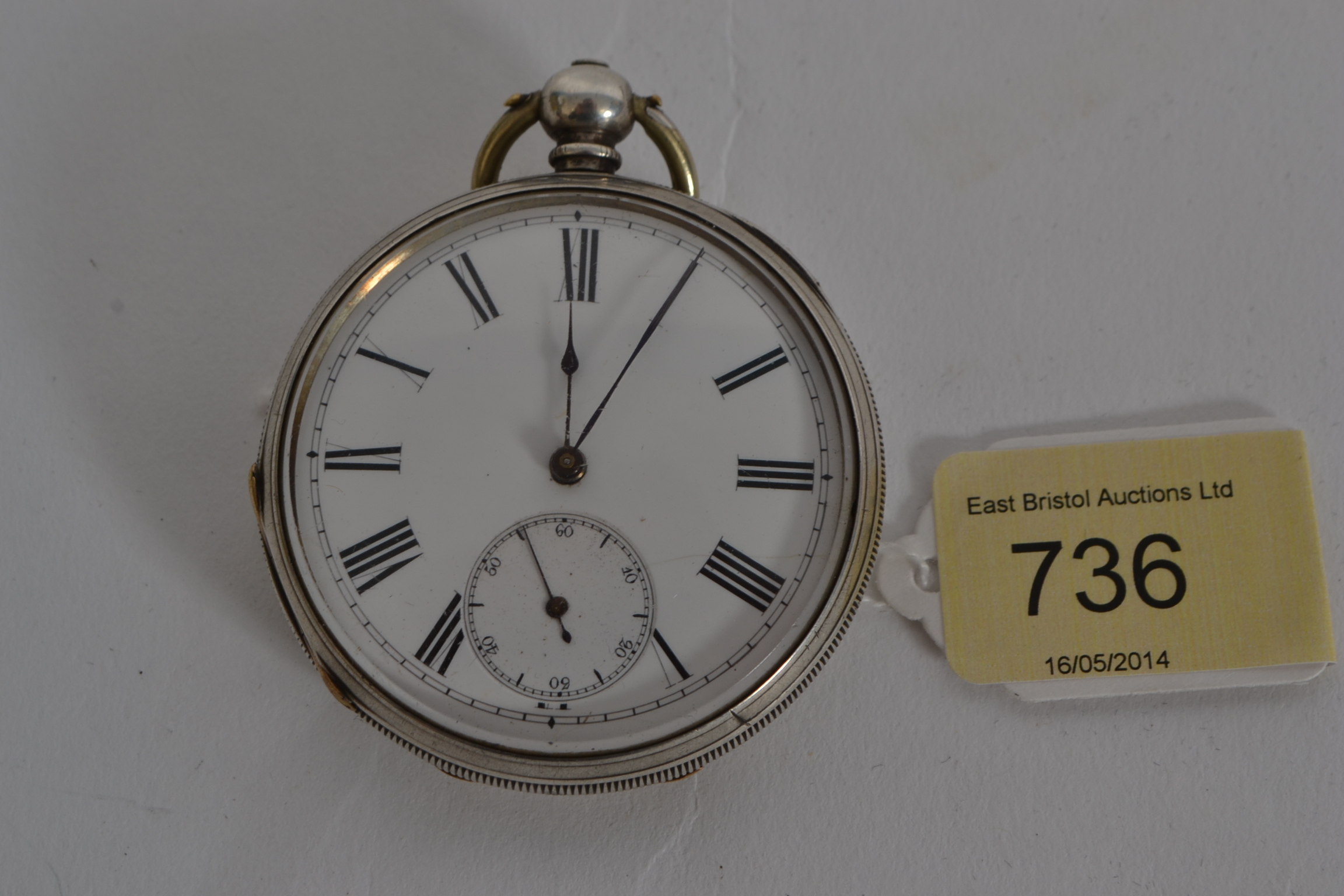 A white metal silver (stamped silver ) 20th century pocket watch with Patent Lever engraving to case