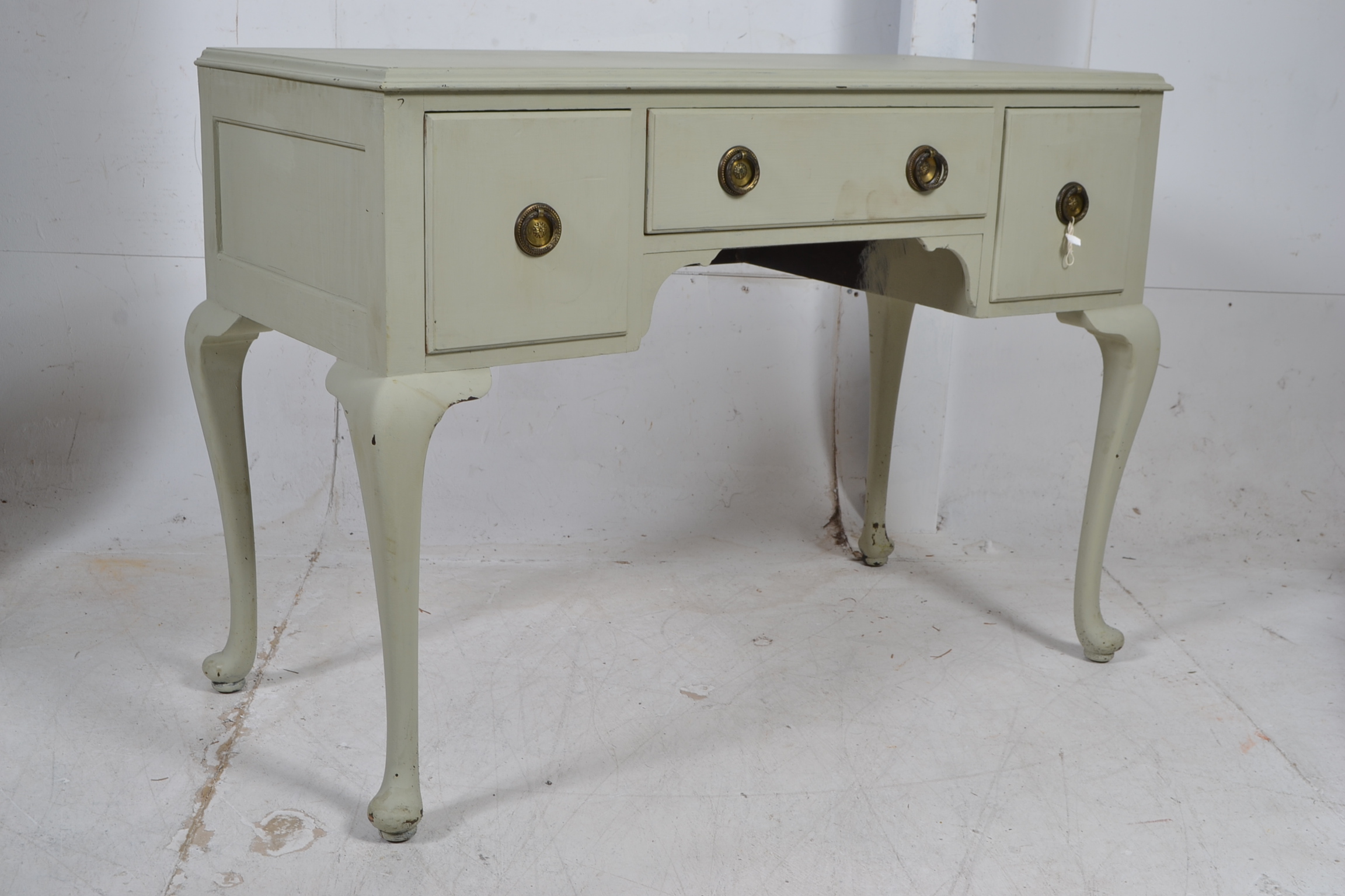A 1930's Queen Anne painted shabby chic / ruf lux writing table desk. Raised on tall cabriole legs