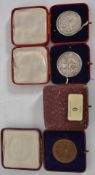 A collection of 1920's hallmarked silver Eisteddfod medals along with some bronze medals