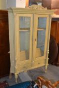 A large 19th century style shabby chic painted pine display cabinet. The large display cabinet of