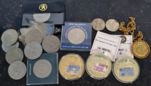 A collection of coins to include metallic first day cover. commemorative coins Windsor mint bank