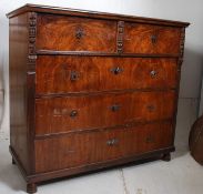 A 19th century continental walnut chest of drawers. Raised on bun feet supporting a deep and wide