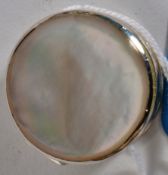 A white silver metal (stamped 925 ) pill box with decorative mother of pearl lid.