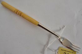 A 1915 hallmarked sterling silver & carved ivory handled fish fork