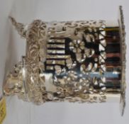 A silver plated bottle holder with repousse decoration.