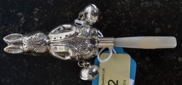 A Victorian style white silver metal (stamped 925) children's toy rattle, with mother of pearl