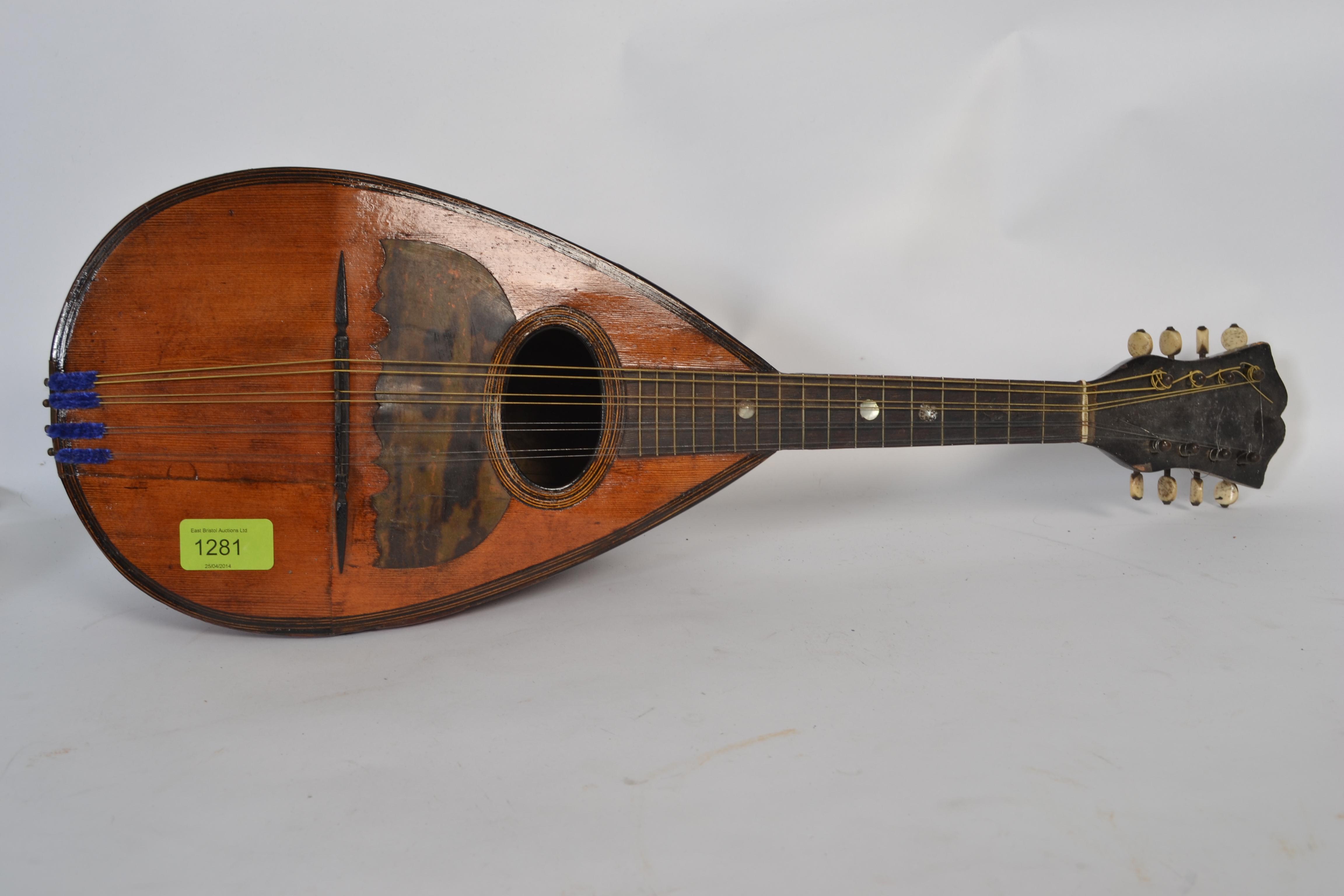 A 19th century mandolin labelled Pietro Tonelli, Napoli to paper panel inside, The rosewood body